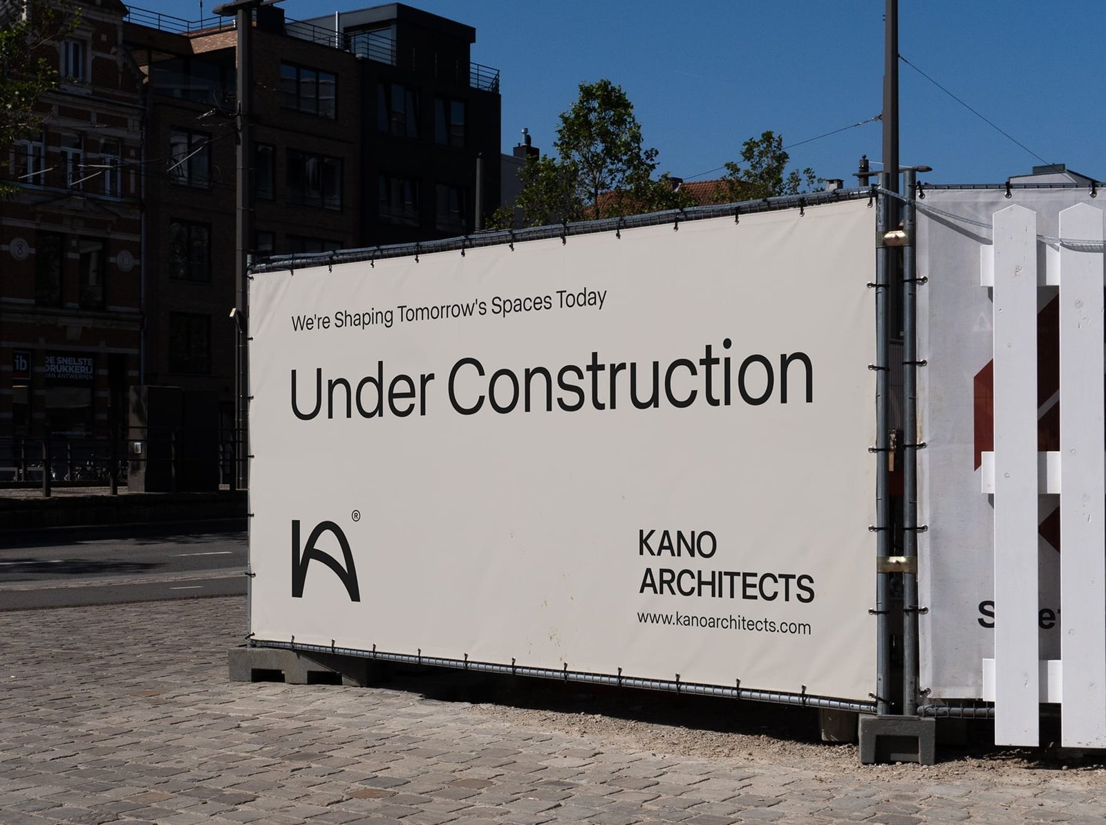 Hoarding advertising announcing a project with bold graphic design